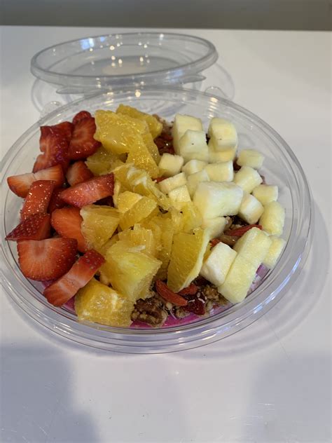 Paradise bowl - Açaí Bowls. Paradise. organic Brazilian açaí topped with Mario’s granola*, strawberries, blueberries, banana, pineapple & raw coconut flakes. drizzled with honey | 765 Cal *Mario’s granola contains nuts. Almond Butter. organic Brazilian açaí topped with almond butter, cacao nibs, Mario’s granola*, strawberries, blueberries, bananas & pineapple | 904 Cal